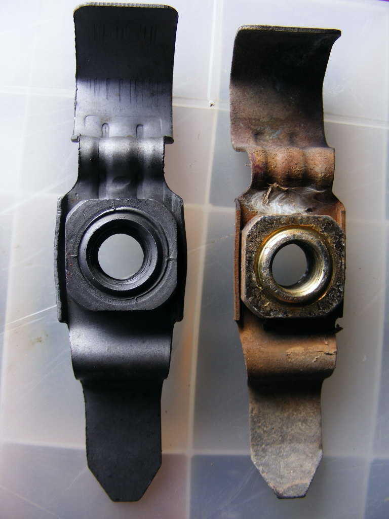 A Mahle W126 braking support rod bushing carrier retaining nut compared with a genuine OEM part