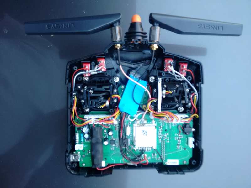 Interior photograph of Devo 7e R/C controller with added switches and communications modules